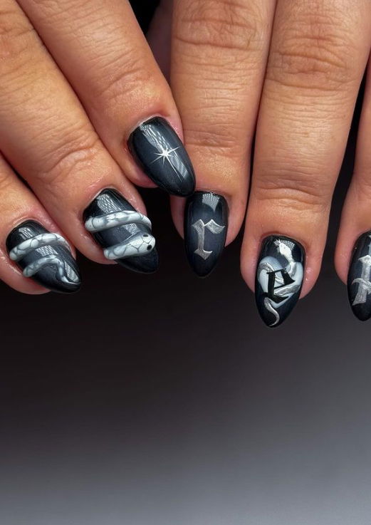 short black gothic stiletto nails with 3D snakes