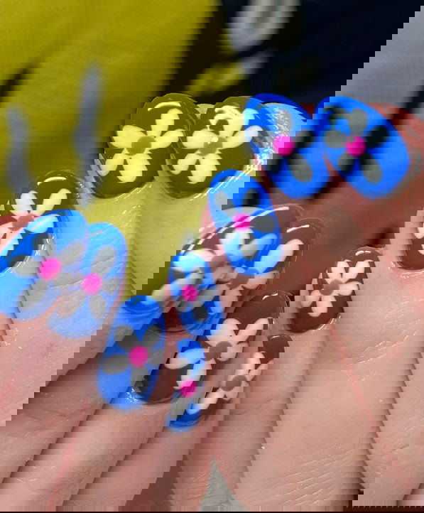 short blue nails with pink and white flowers