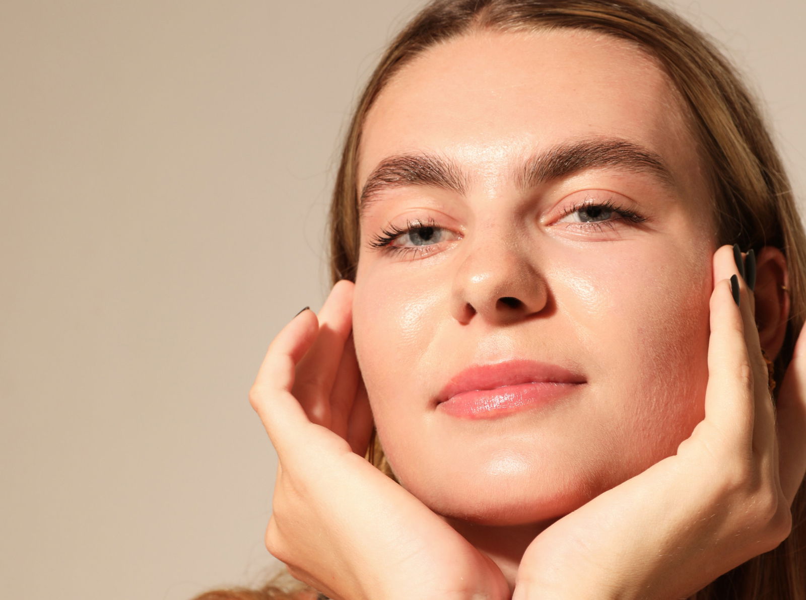 Young gorgeous woman, poses on white wall. Mind set concept. Mock-up. Vertical. High quality photo. Retinol ingredients skincare makeup