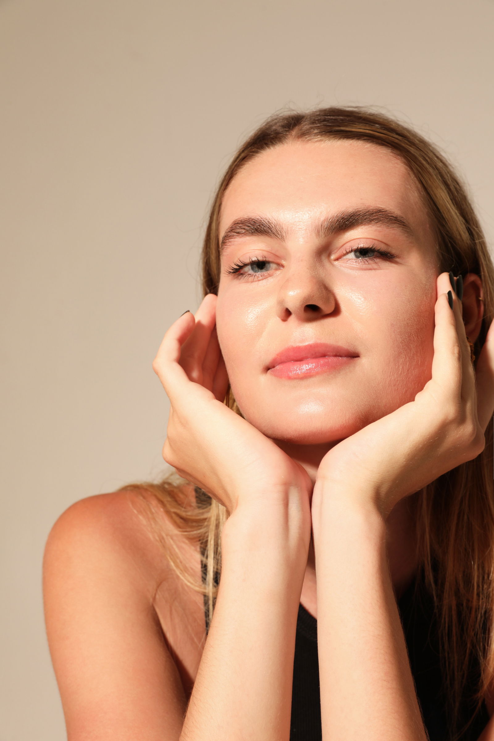 Young gorgeous woman, poses on white wall. Mind set concept. Mock-up. Vertical. High quality photo. Retinol ingredients skincare