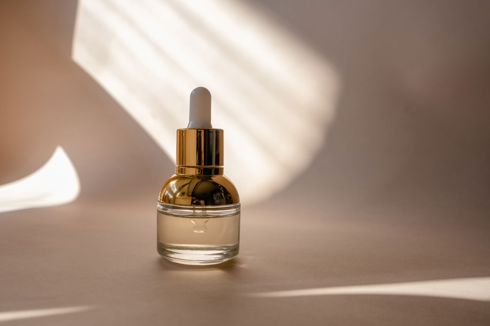 A close-up shot of a frizz-control product for hair, highlighting the importance of using specialised products for a smooth and shiny result.