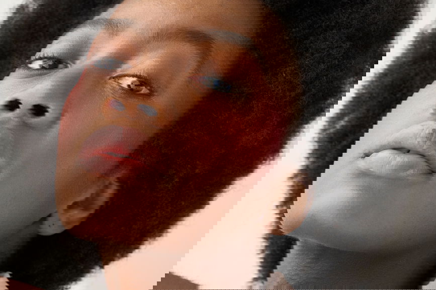 Woman showing how to pick the perfect blusher colour