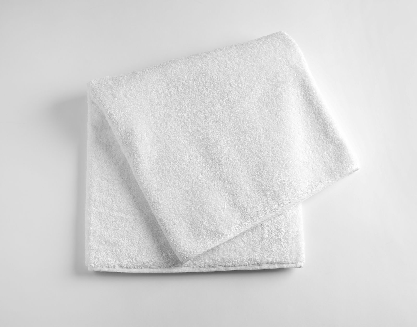 Clean towel showing importance of using clean products after working out for back and shoulder acne