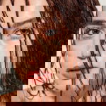 Woman putting conditioner in her hair showing how often to use a hair mask