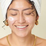 Woman using retinol to firm her skin