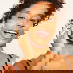 Woman exfoliating her face showing the different types of exfoliatior