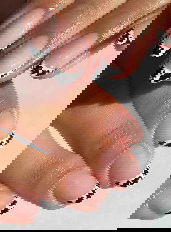 black and white cow print french tips