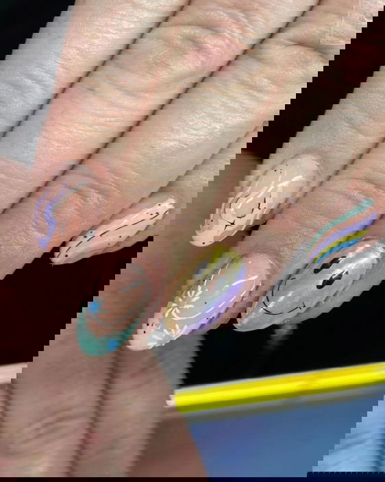 Chrome smiley face nail design