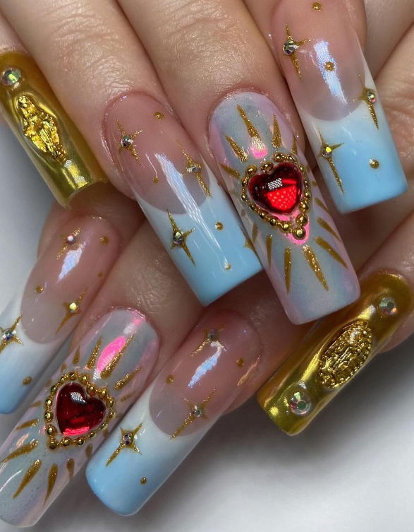 Light blue French tip nails with gold charms and details