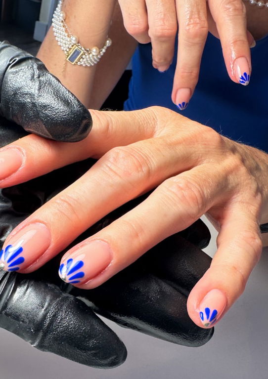Sheer nails with royal blue petal French tips