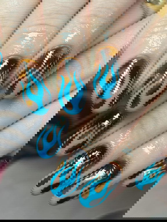 Tortoiseshell nails with bright blue flame French tips