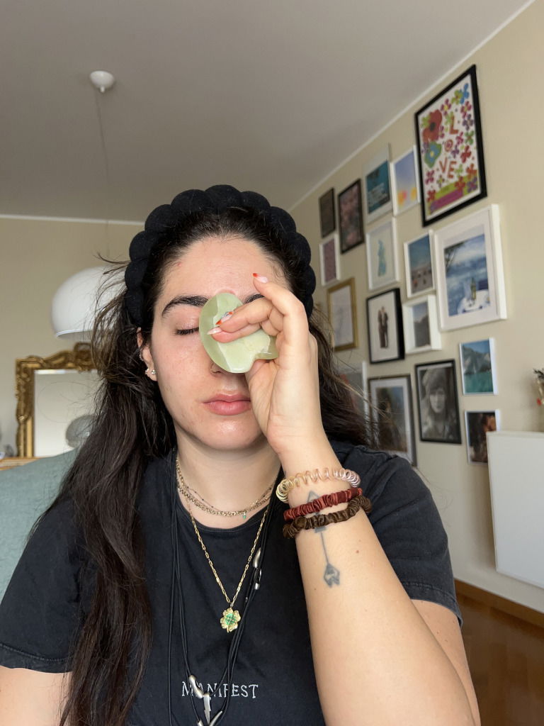 Journalist Fani Mari shows how to use a gua sha on your acupressure point