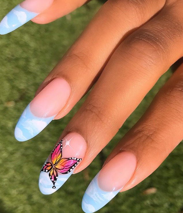 baby blue cloud french tip nails with y2k butterfly designs