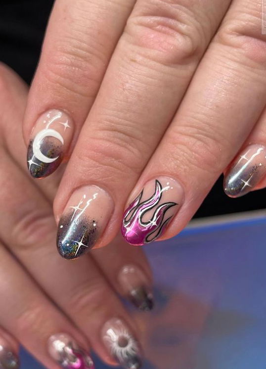 black and nude ombre nails with pink chrome flames
