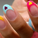 bright French tip nails with hearts hang