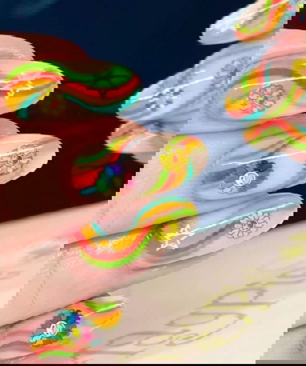 bright nails with flower smiley faces