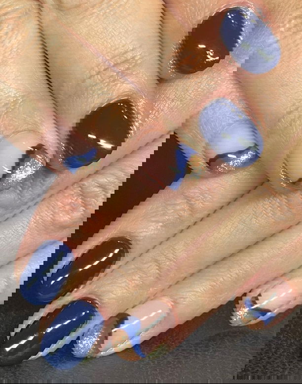 dark blue nails with blue and gold French tip feature nails