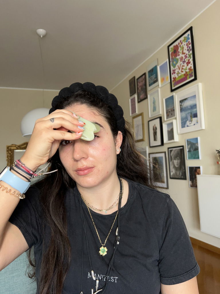 Journalist Fani Mari shows how to use a gua sha on your eyes