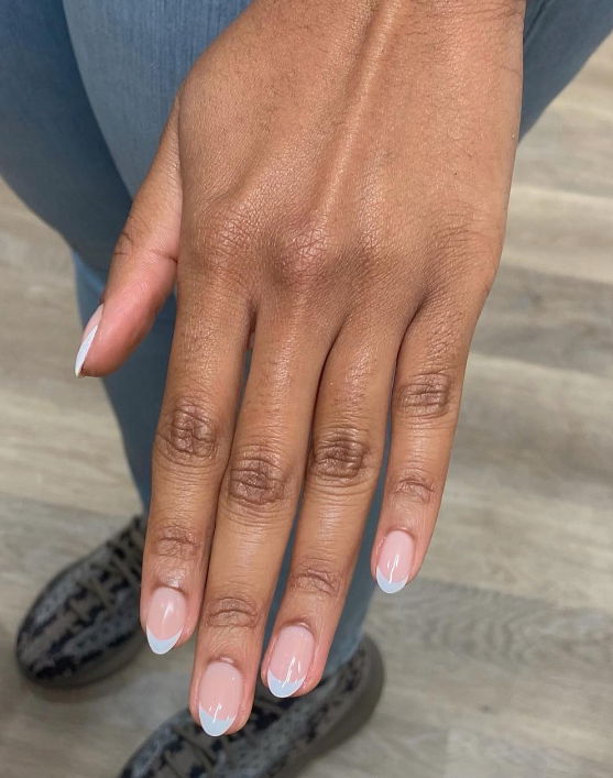 light blue BIAB short almond french tip nails