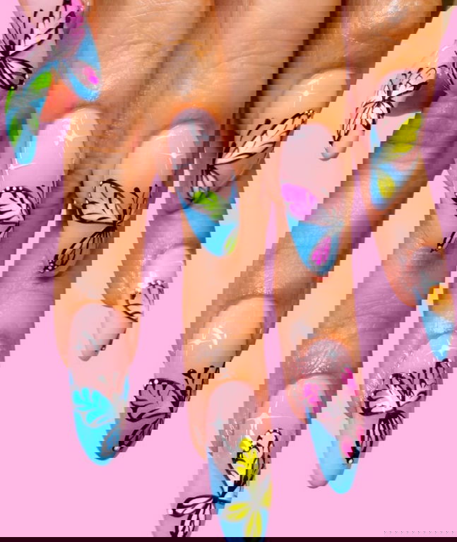 long blue french tip nails with stars and butterflies