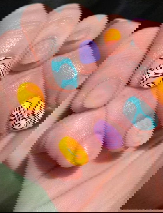 pastel melted smiley face nails