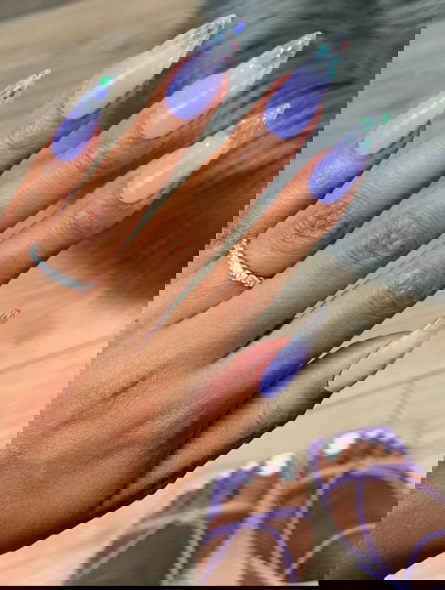 purple stiletto nails with glitter tips