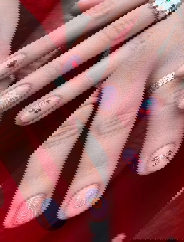 mismatched nail art with bows and cherries