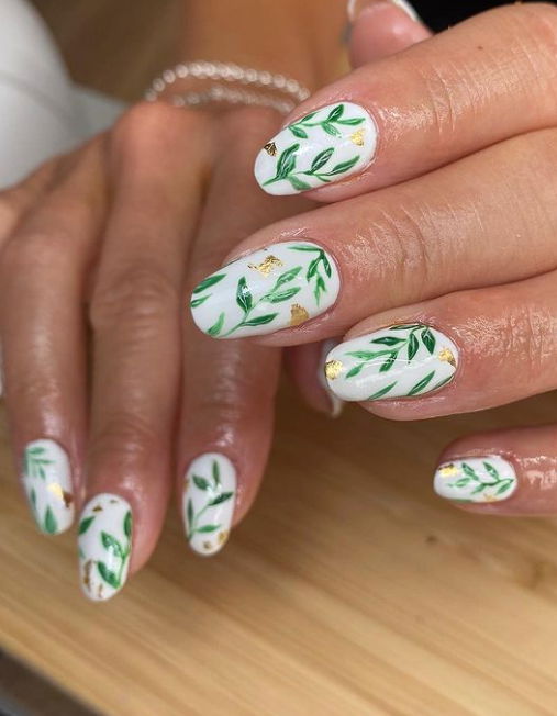 white spring nails with tropical leaves