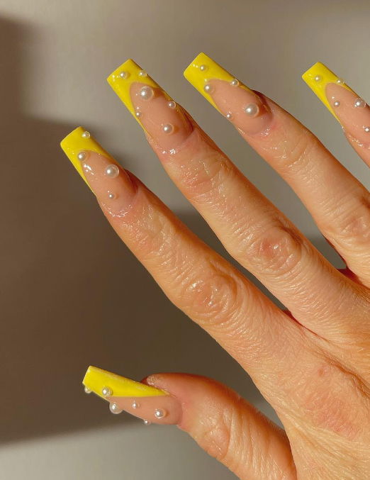 yellow french tip spring nails with pearls
