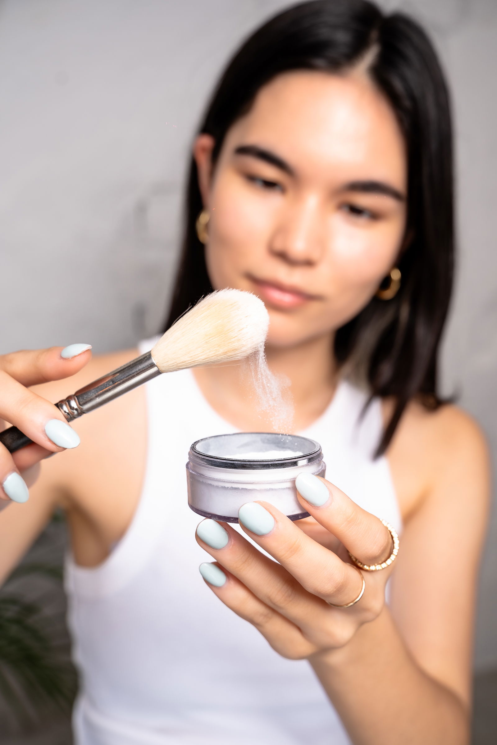 Girl showing how much setting powder to use