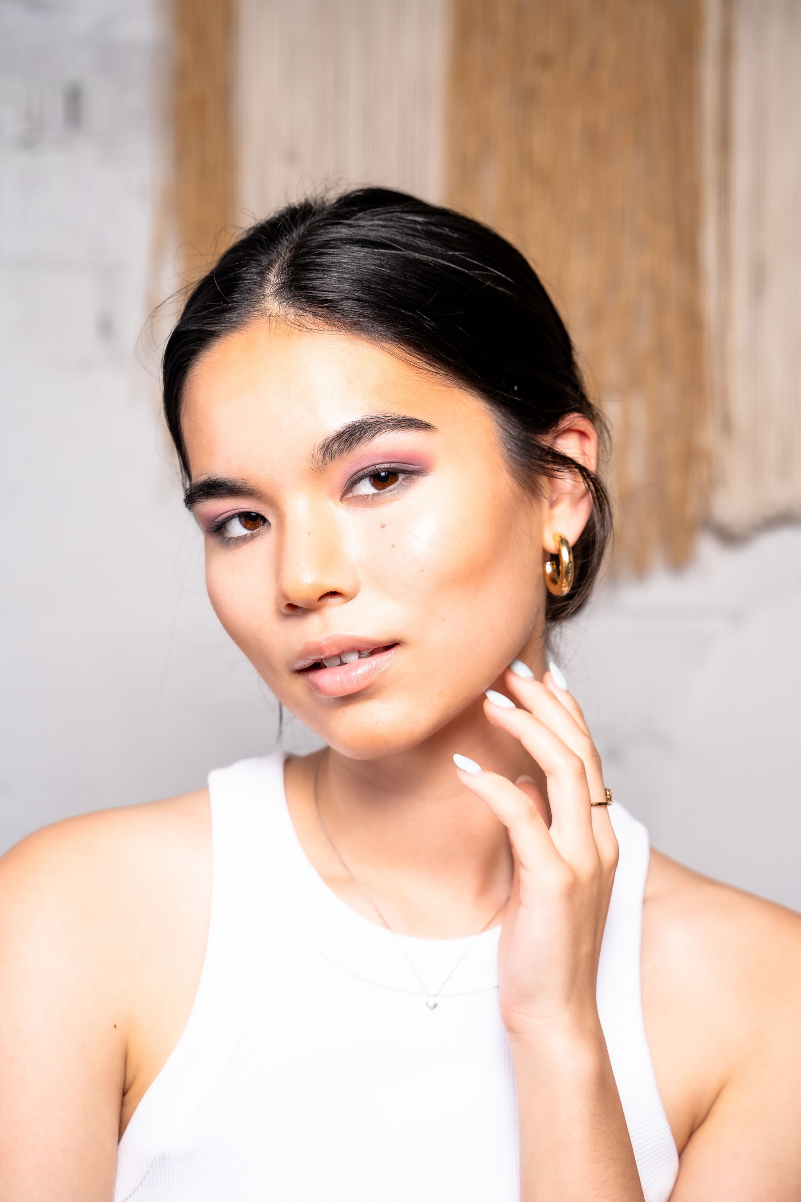 | Live That Glow Girl showing her face after contouring brown eyes eyeshadow smokey eye