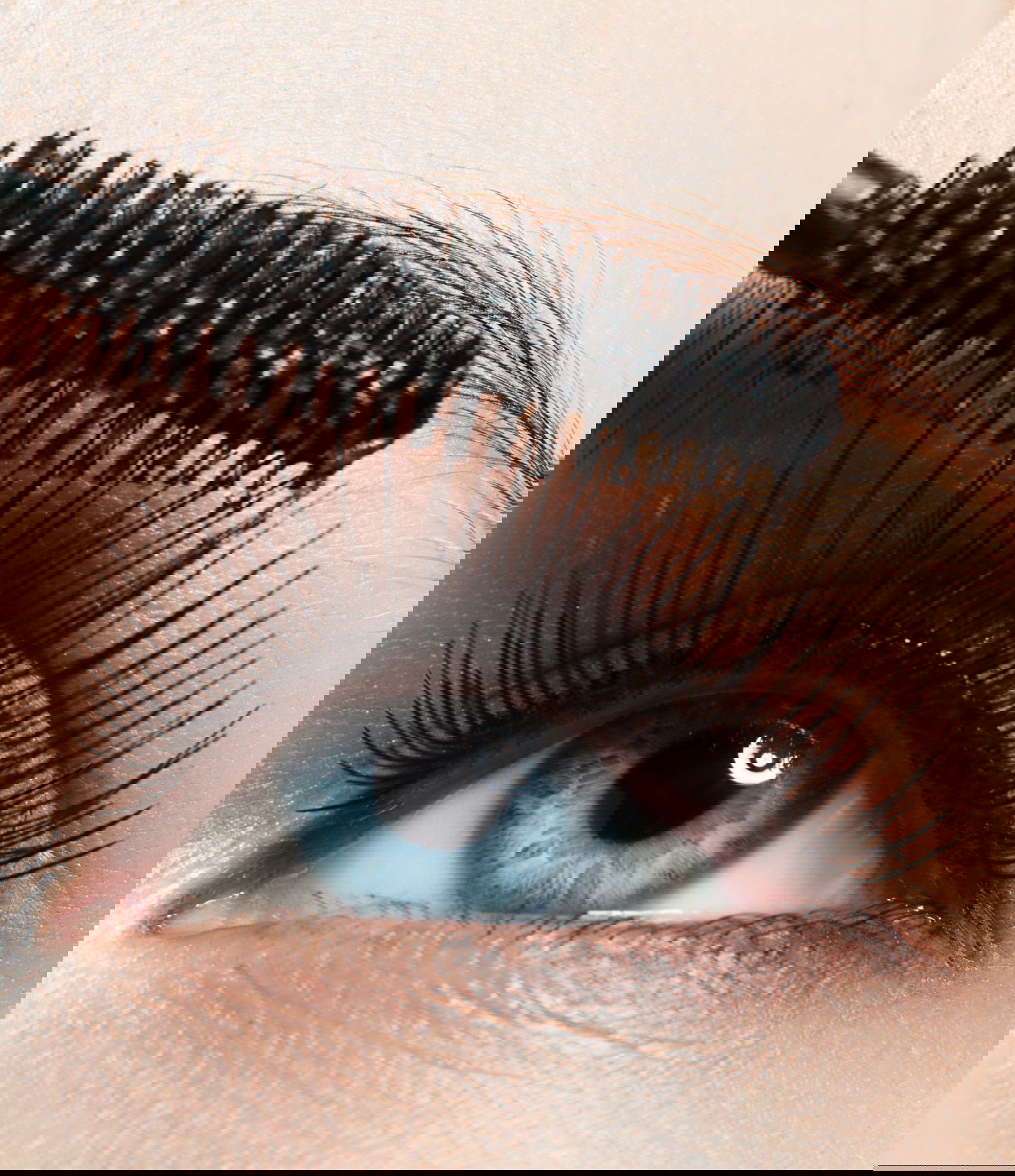 Close-up of blue eye with long lashes with mascara