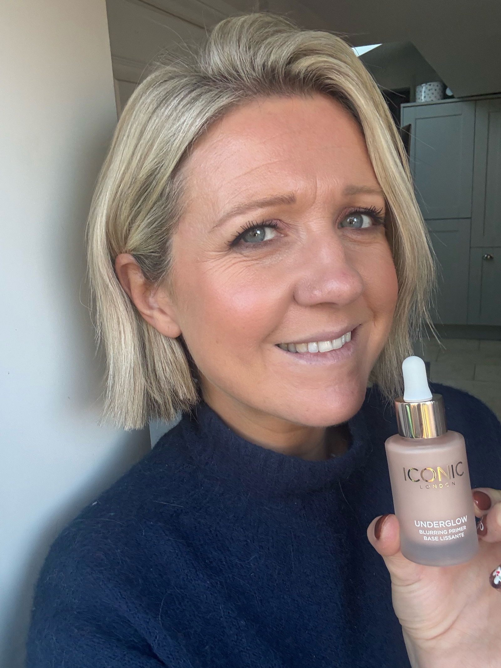 Iconic London Underglow Blurring Primer on woman's skin showing results of the primer