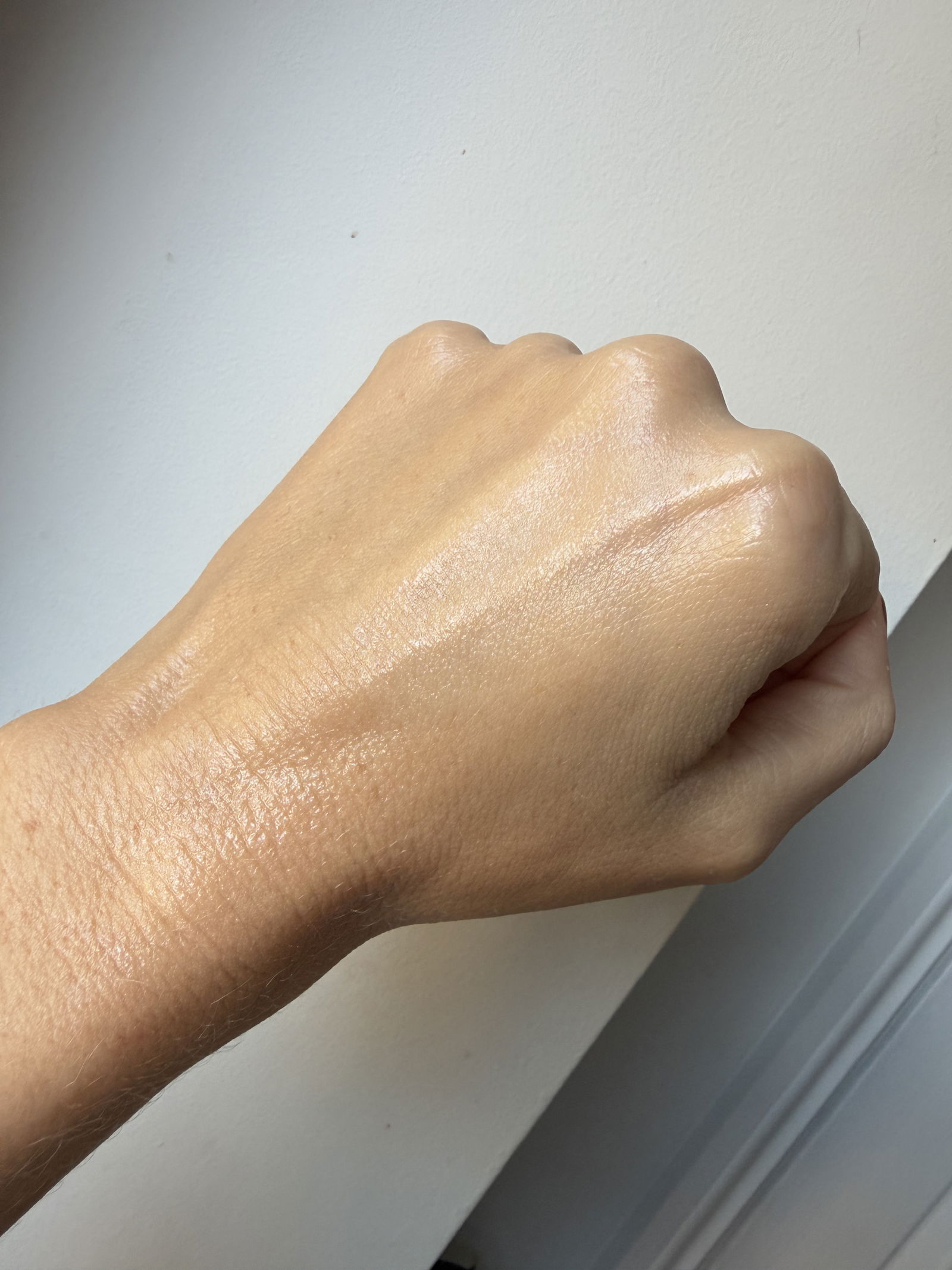 Iconic London Underglow Blurring Primer swatch rubbed in on hand