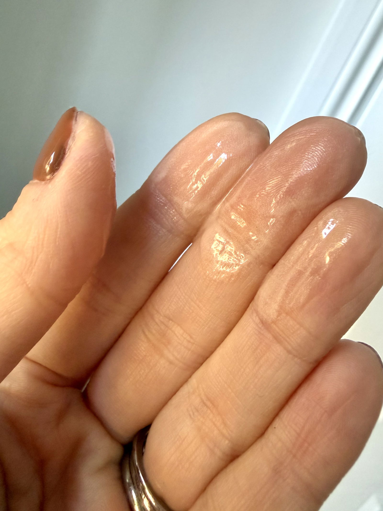 Iconic London Underglow Blurring Primer product texture on fingers